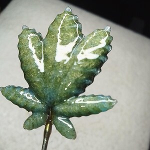 May include: A rustic wooden sign with the text "Welcome to our home" in white lettering. The sign features a distressed finish and a simple, inviting design, perfect for entryway decor.