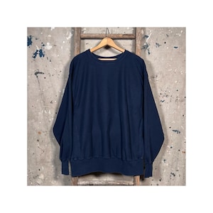 May include: A dark blue long-sleeved sweatshirt with a crew neck.