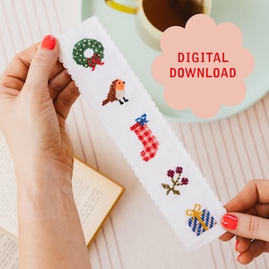 May include: White bookmark with embroidered Christmas-themed designs, including a wreath, bird, stocking, berries, and a gift. The text "DIGITAL DOWNLOAD" is in a pink cloud shape.