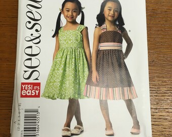 Sewing pattern for girls dress pullover sizes 2 through 8