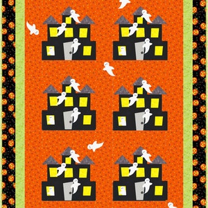 May include: A quilt with a Halloween theme featuring a repeating pattern of black houses with yellow windows and white ghosts flying around them. The background is orange with white polka dots. The border is black with orange jack-o-lanterns.