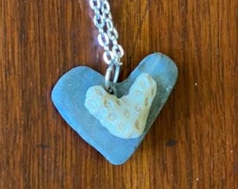 Heart rock with coral heart pendant on silver jump ring on sterling chain 20 inches long.