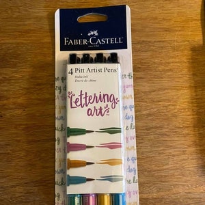 Faber Castell Pitt Lettering pens set of four, new in package, brush tip.