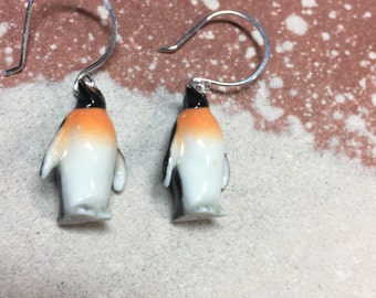 Adorable porcelain Penguin earrings hanging on handmade hammered  Round Sterling silver earwires.