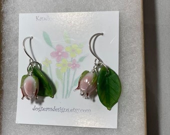 Gorgeous light pink Handblown glass Lampwork Rosebud earrings with delicate glass leaf hanging on Sterling handmade hammered round earwires.