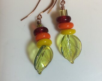 Sunny and Bright Yellow, orange and red stacked, beaded dangly earrings on shiny glass leaf headpins hanging on copper french hook earwires.