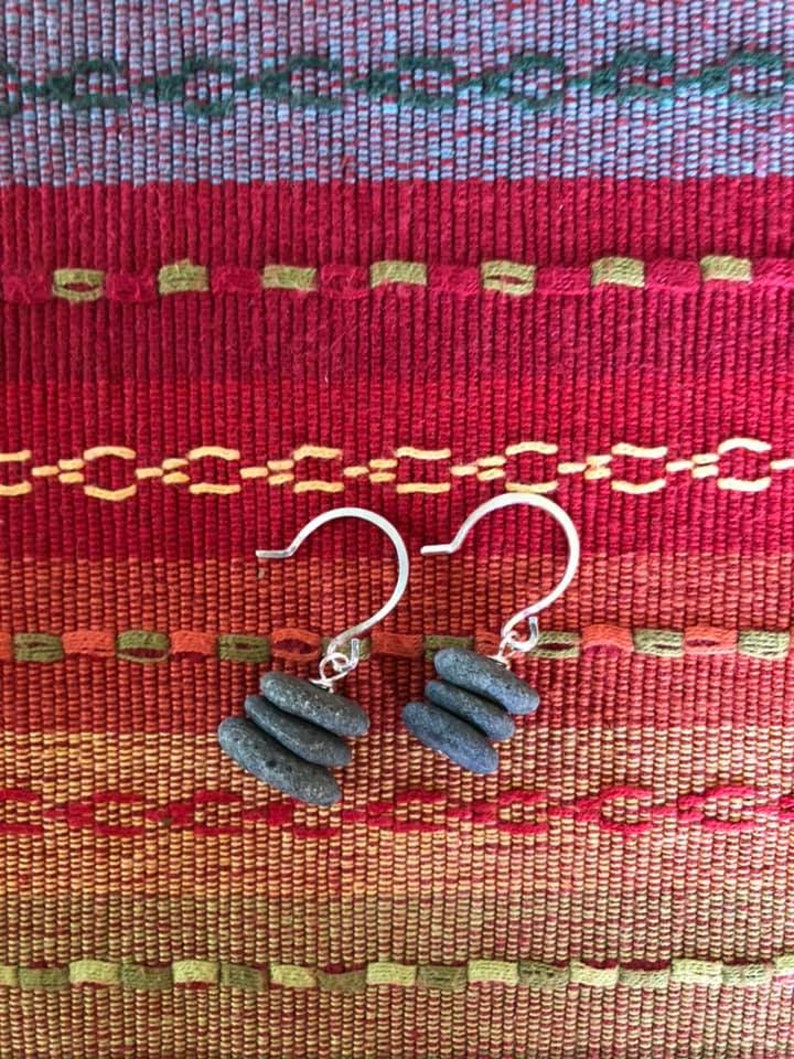 Beautiful earrings made of stacked tiny stones center drilled on a silver headpin hanging on handmade hammered round earwires.