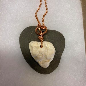 Heart Rock Pendant with heart shaped white textured shell on Copper wire bale hanging on copper ball chain any length.