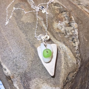 Heart Pendant made of tile piece and heart seaglass with tiny green seaglass rondelle hanging on sterling wire with spiral on top.
