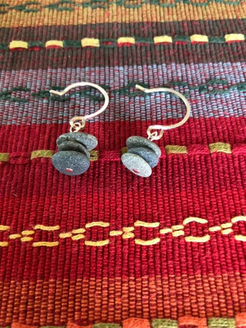 Beautiful earrings made of stacked tiny stones center drilled on a silver headpin hanging on handmade hammered round earwires.