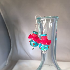 Lampwork glass red and bright aqua dotted and swirled beaded dangly earrings on sterling silver earwires.