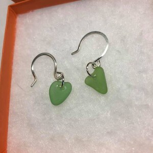 Beautiful heart shaped tiny green Authentic Seaglass earrings on sterling silver handmade hammered round earwires.