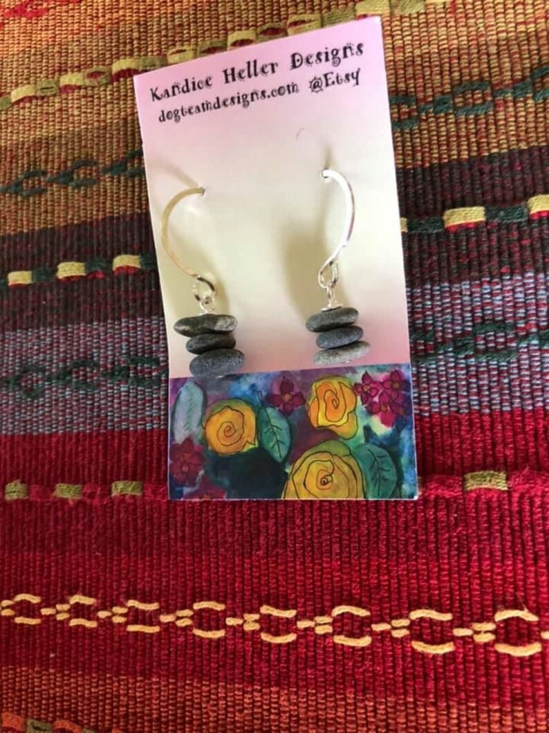 Beautiful earrings made of stacked tiny stones center drilled on a silver headpin hanging on handmade hammered round earwires.