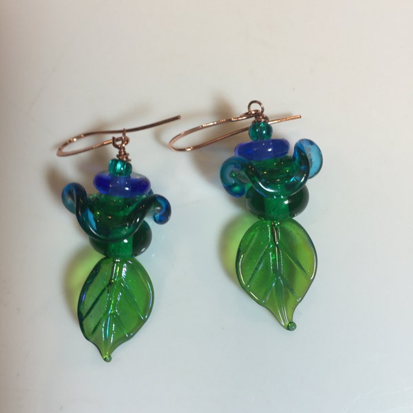 Cobalt Blue and Kelley Green with Blue ruffle beaded dangly earrings on shiny glass leaf headpins hanging on copper french hook earwires.