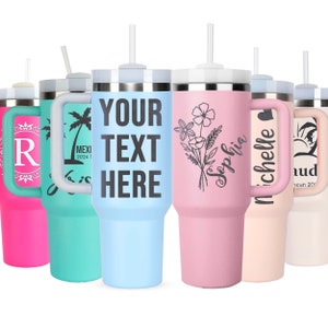 May include: Set of six stainless steel tumblers with various designs and text. The tumblers are light blue, pink, teal, white, and two shades of pink. Each tumbler has a lid and a straw. The text on the tumblers includes "Your Text Here", "Sophia", "Michelle", "R", "Mexico 2024", and a palm tree.