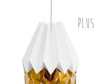 May include: A white and gold origami-style pendant light fixture. The upper portion is white, while the lower section is gold. The light hangs from a neutral-colored cord. The word "PLUS" is written in black script.