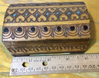 Hand carved polish box with hinged lid.