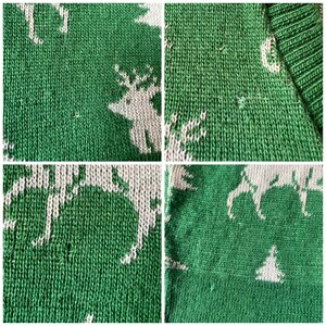 May include: Green knitted sweater with a white reindeer pattern. The sweater has a V-neck and is made of a soft, comfortable material.