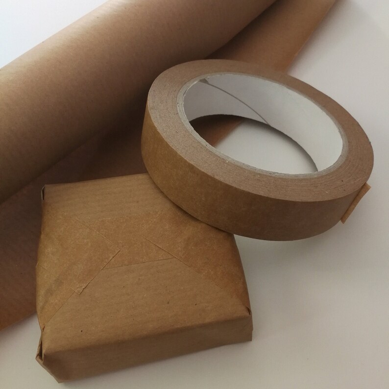 May include: A roll of brown kraft paper, a roll of brown packing tape, and a small brown cardboard box.