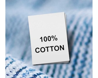 Peut inclure: Une étiquette en tissu blanche avec du texte noir qui indique "100% COTON".
