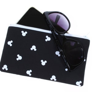 May include: Black zippered pouch with a white Mickey Mouse pattern. The pouch is filled with a black smartphone and sunglasses.