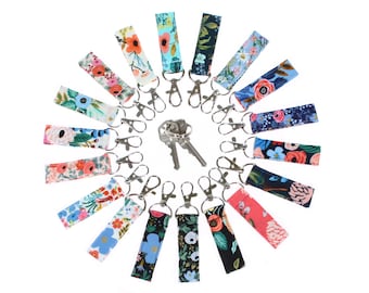Llavero Mini Bag Charm con gancho giratorio, tirador de cremallera para mochila, tela Rifle floral