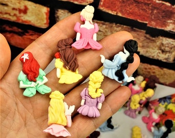 May include: A collection of colorful, hand-painted, miniature figurines of princesses with different hairstyles and dresses. The figurines are made of polymer clay and are perfect for crafting and decorating.