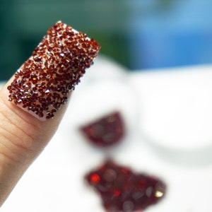 Garnet red crystals for nails.