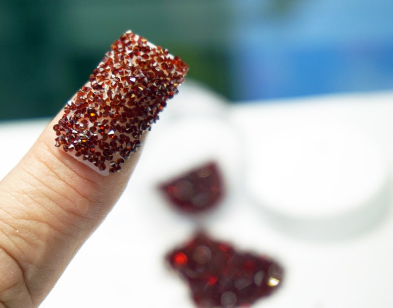 Garnet red crystals for nails.