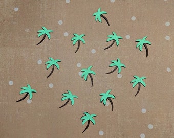 May include: A brown background with white dots and 14 green palm trees with black trunks.