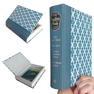 May include: A hollowed-out book box with a blue spine and a white cover featuring a blue geometric pattern. The spine displays the text Reader's Digest Best Loved Books For Young Readers, Bob, Son of Battle, Oliver Twist, Modern American Poetry, Cry, the Beloved Country, and the number 11.