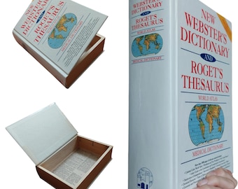 May include: A white hollow book box titled New Webster's Dictionary and Roget's Thesaurus with a world map graphic. The box is shown closed, partially open, and fully open, revealing a wooden interior and a printed dictionary page base.