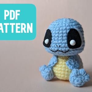 May include: A crochet pattern for a blue and yellow turtle amigurumi. The pattern is available as a PDF download.
