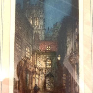 May include: A vintage etching depicting a narrow street in a city at night. Tall buildings line the street, with a large church tower dominating the background. A single lamppost illuminates the street, and a figure can be seen walking in the distance. The etching is titled "Holborn (Ludgate Court) Sapphire Hours".