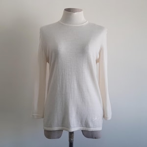 Jersey de punto vintage Genny 100% lana color crema, cuello alto, ligero, estilo italiano, talla pequeña a mediana.