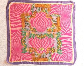 May include: A square silk scarf with a vibrant pink and purple design. The scarf features a central checkered pattern, surrounded by radiating lines and ornate floral and architectural elements. The border is a solid purple.