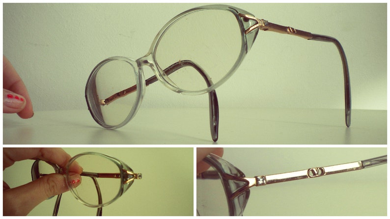 May include: Clear plastic framed glasses with gold metal accents and a brown plastic temple. The glasses have a cat-eye shape.