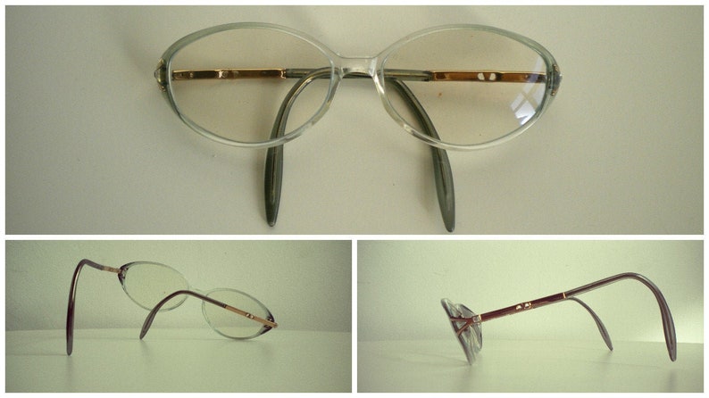 May include: Clear plastic oval-shaped eyeglasses with brown metal arms. The glasses are shown from the front and from two side angles.