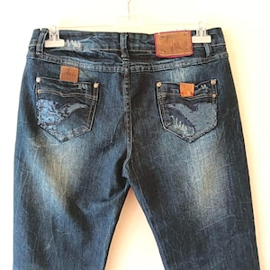 ARMANI Cigarette denim pants. Low waist. Washed dark blue. Leather labels. Back pocket decoration. Size 46. Made in Italy. Great condition.