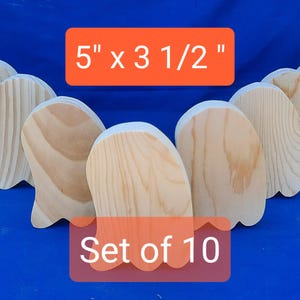May include: Set of 10 unfinished wooden ghost shapes, each measuring 5 inches by 3 1/2 inches. The ghosts are made of natural wood and are ready to be painted or decorated.