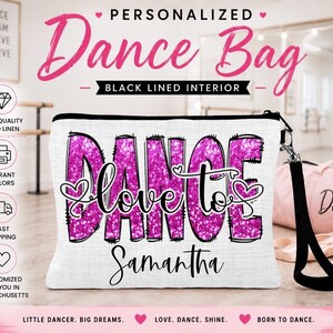 May include: A white dance bag with a black zipper and wrist strap. The bag features the words "DANCE" and "love to" in a glittery pink font, with the name "Samantha" below. A pink water bottle and a pink duffel bag are also visible.