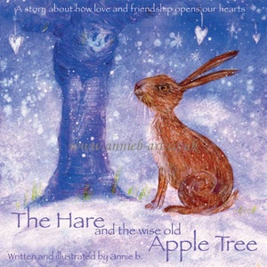 May include: A children's book illustration featuring a brown hare sitting in a snowy landscape, looking up at a blue tree with hearts hanging from its branches. The text reads "The Hare and the wise old Apple Tree. Written and illustrated by annie b."