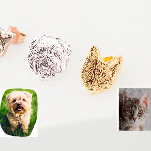 May include: Four different pet portrait earrings, each featuring a different animal. The earrings are made of metal and have a gold, silver, or rose gold finish. The portraits are of a cat, a dog, a cat, and a dog.
