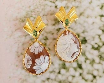 Golden earrings with cameos and green zircons