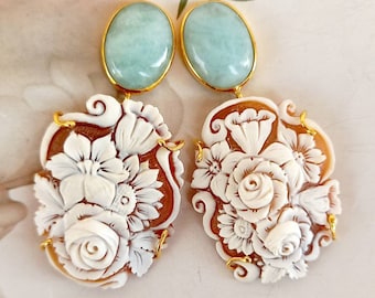 Aquamarine cabochon earrings and floral cameos.