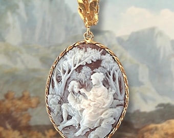 Cameo pendant with bucolic scene and gold plated silver setting.