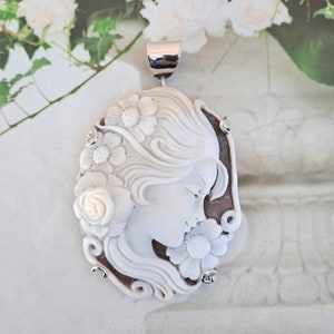 Cameo pendant with a woman's face and silver frame