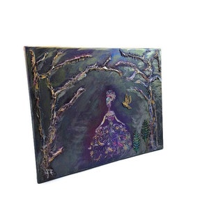May include: A painting of a woman in a purple dress standing in a dark forest with gold and silver accents. The woman is surrounded by trees and a bird is flying above her.