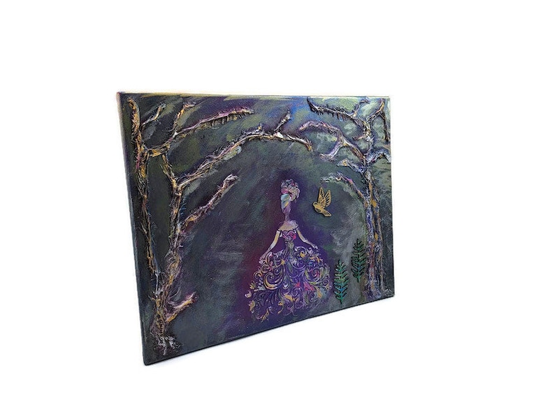 May include: A painting of a woman in a purple dress standing in a dark forest with gold and silver accents. The woman is surrounded by trees and a bird is flying above her.