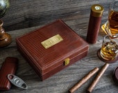 Personalized leather humidor box gift set with matching accessories.